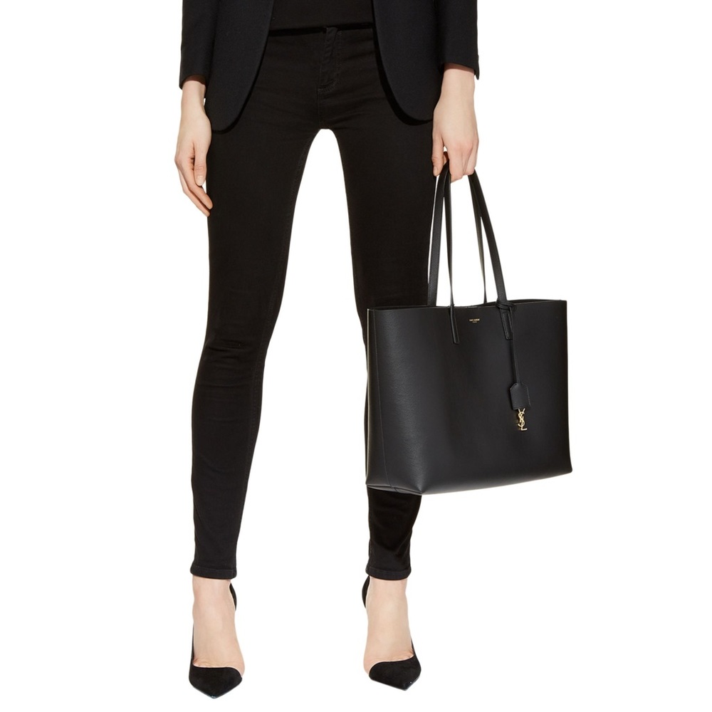 Yves Saint Laurent black shopping tote with attached satchel.